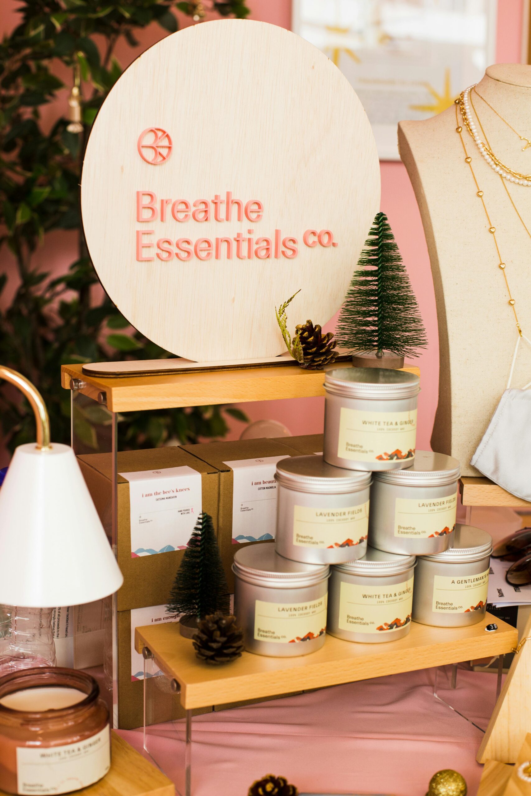 A stylish product showcase of scented candles by Breathe Essentials Co.